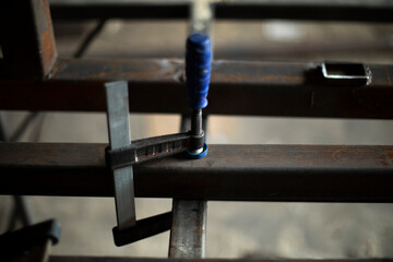 Metal processing in garage. Steel billet in garage.