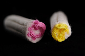 Tampon is a menstrual product designed to absorb blood and vaginal secretions by insertion into the vagina during menstruation.