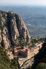 Obraz premium looking down at the abbey of montserrat near barcelona, spain