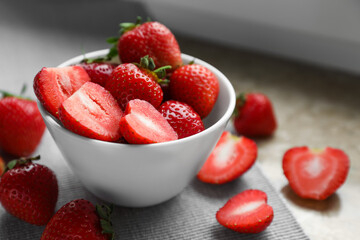 Fresh juicy strawberries on table, closeup view