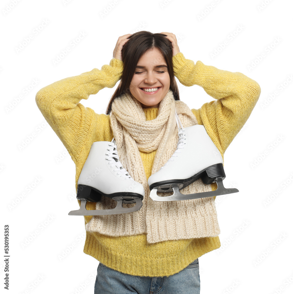 Wall mural Happy woman with ice skates on white background