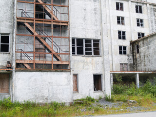 Fototapeta na wymiar Deserted and derelict old industrial building