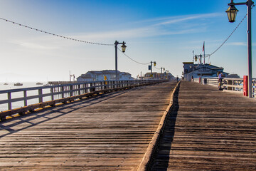 Fototapeta premium Santa Barbara, California. August 13 2022 - View of Stearn's Wharf in the early morning with tourists