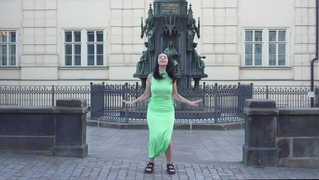 Young woman in Prague dance and Jumping for Create Viral Reel dance Jump. Video cut transaction changing  location in jump.