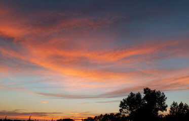 Obraz premium orange sunset with clouds above