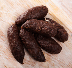 Popular Catalan blood sausage (morcilla) with rice on wooden background..
