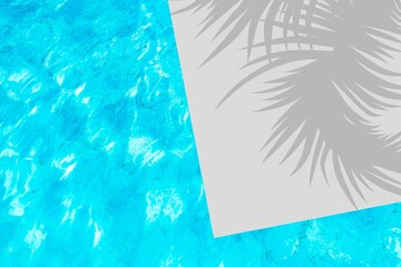 Fototapeta na wymiar Swimming pool water and palm shadow