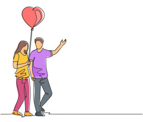 Obraz na płótnie Canvas One single line drawing of young happy man and woman couple take a walk together and holding a heart shaped balloon. Romantic marriage love concept continuous line draw design vector illustration