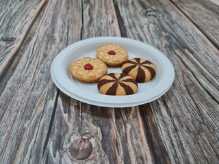 Snacks made from flour and other ingredients, namely chocolate cookies and blueberry jam filled biscuits