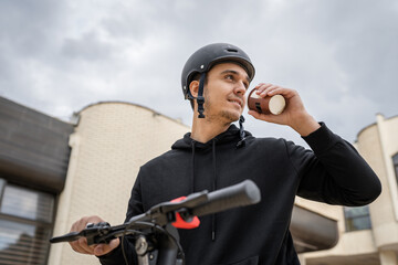 caucasian man drive or ride electric kick scooter e-scooter