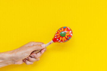 Maracas on a yellow background.  Latin american music concept