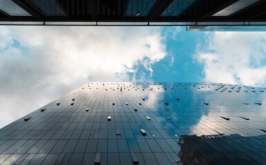 glass buildings reflecting the sky