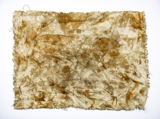 Authentic stained dirty rag on a white isolated background. Dirty, soiled rag.