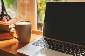 cup of coffee on laptop