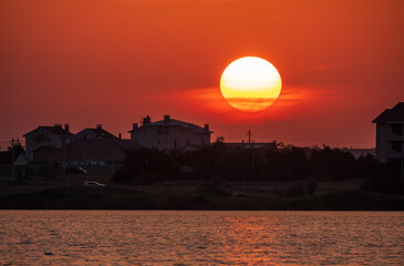 The sun goes down over a lake