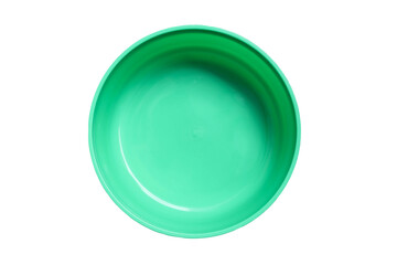 Empty green plastic bowl, top view isolated on white background closeup.