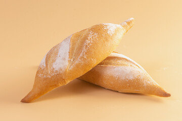 bread baguette on orange background