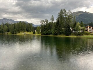 Alpine mountain lake Schwarzsee or Black Lake between the tourist towns of Davos and Klosters - Canton of Grisons, Switzerland (Kanton Graubünden, Schweiz)