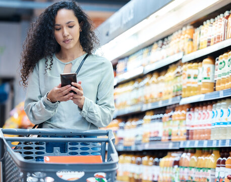 Supermarket, phone and woman shopping, search and on internet for grocery store product, drink or juice. Customer on 5g technology fintech app for buying healthy or wellness food in inflation economy