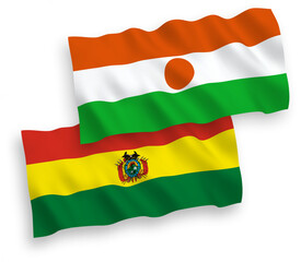 Flags of Republic of the Niger and Bolivia on a white background