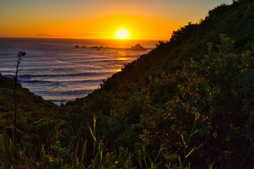 Fototapeta na wymiar Sunset over Houghton Bay, Wellington, with views to the South Island, New Zealand