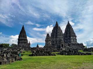 Majestic view of Prambanan Temple as Historical Indonesian Hindu Holy Temple on sunny day with blue sky background. Prambanan Temple as UNESCO world heritage site is located on Sleman, Indonesia.