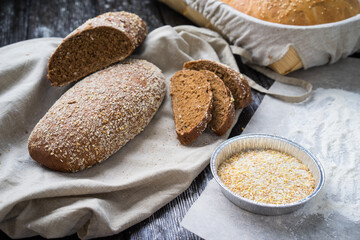 Freshly baked traditional bread on wooden table