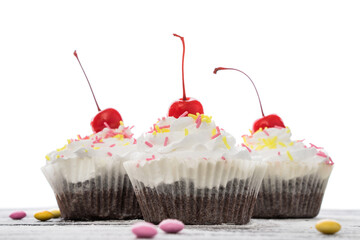 three Delicious cupcakes with cream