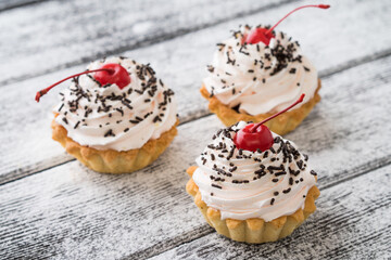 three Delicious cupcakes with cream