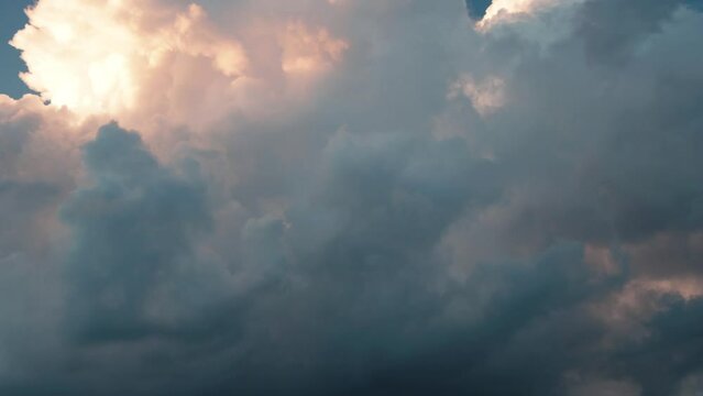 Timelapse of cumulus clouds moving in the blue sky. Light clouds change their shape in cloud space. 