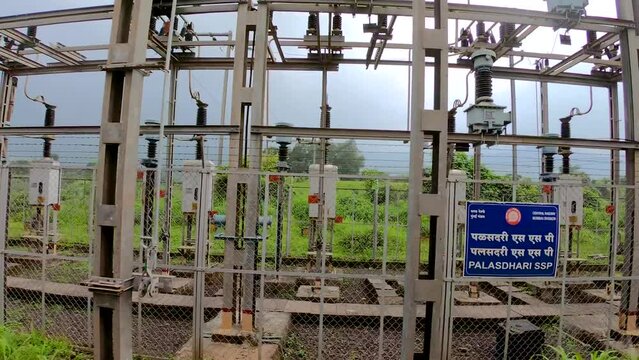High voltage power station for Railways electricity high | voltage substation with tall pylons and voltage distribution cables of Railways. Transformation station and electric power plant \ Powerhouse