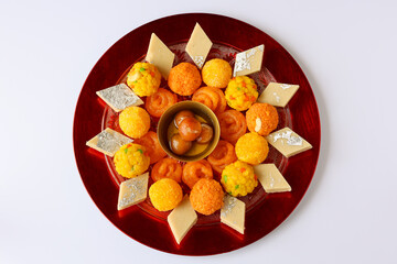 Diwali sweets Mango chum chum barfi petha Laddu Jalebi peda Indian sweet festival dish mithai...