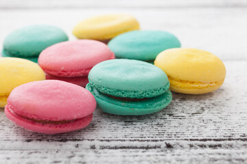 Tasty sweet macarons on a table.
