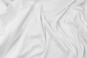 White fabric. luxurious white fabric texture background. Creases of satin, silk, and cotton..