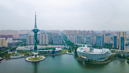 Aerial photography of Julong Lake Park, Cultural and Art Center, and "Jing of Yancheng" Radio and TV Tower in Yandu District, Yancheng City, Jiangsu Province, China