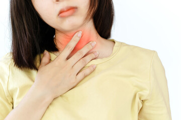 A woman's sore throat has red areas. Health care concept.