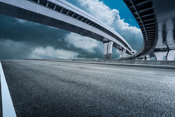 Asphalt highway and bridge with cloud background