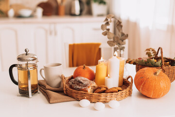 Beautiful interior with autumn mood with pumpkins and candles.