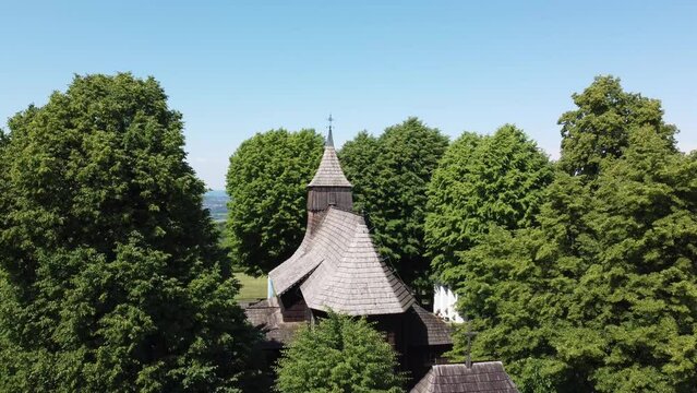 St. Martin's Hill (G&oacute;ra Św. Marcina (Zabłocie)) in Tarn&oacute;w, Poland. Site of the St Martin the Bishop Wooden Church, cemetery, and Tarnowski Castle ruins - Zawada- 4K 30FPS Drone Rotating Left