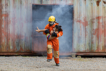 Firefighters wearing helmets with fire safety equipment Use Twirl aerosol fire extinguishers to...