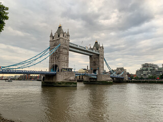 Fototapeta na wymiar Tower Bridge over Thames river during overcast day in London. Tower bridge above Thames river. One of the main sightseeings in capital of Great Britain. City of London, England, UK