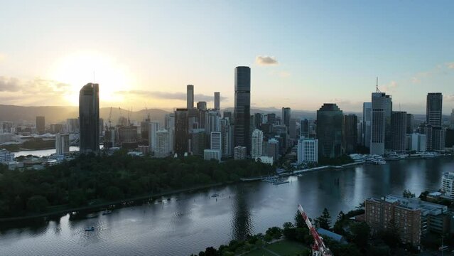 Aerial footage of Brisbane CBD, from above Botanical Gardens and Brisbane River looking towards CBD skyscrapers.