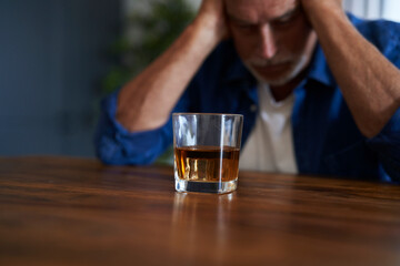 Obraz na płótnie Canvas Senior caucasian man with alcohol problem