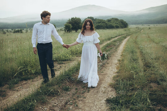 Beautiful wedding couple in nature. Wedding. Bride and groom on their wedding day. High quality photo