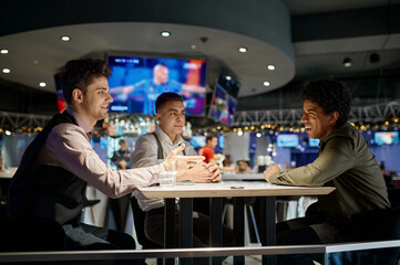 Group of friends rest in sport bar