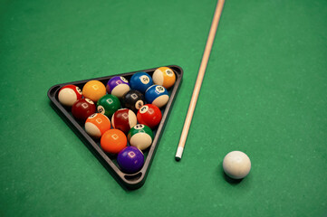 Billiard table with green surface and balls