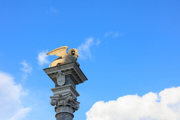 statue of the lion of San Marco on a sky background.