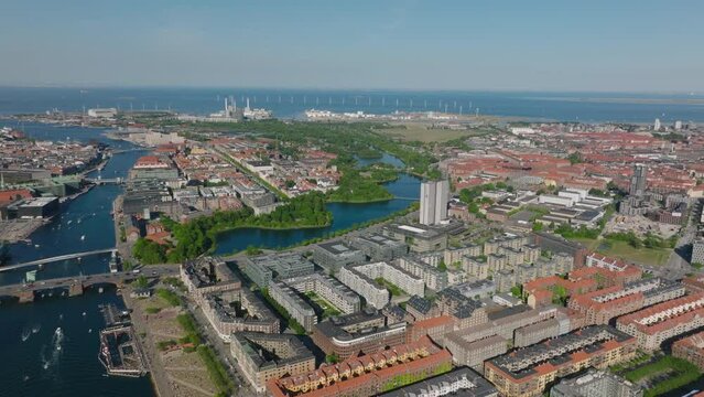 Aerial view of buildings in urban borough. Water canal originally used as part of bastioned ring fortifications. City on sea coast. Copenhagen, Denmark