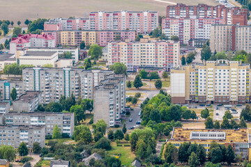 Fototapeta na wymiar aerial panoramic view from a great height of a small provincial town with a private sector and high-rise apartment buildings
