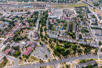 aerial panoramic view from a great height of a small provincial town with a private sector and high-rise apartment buildings